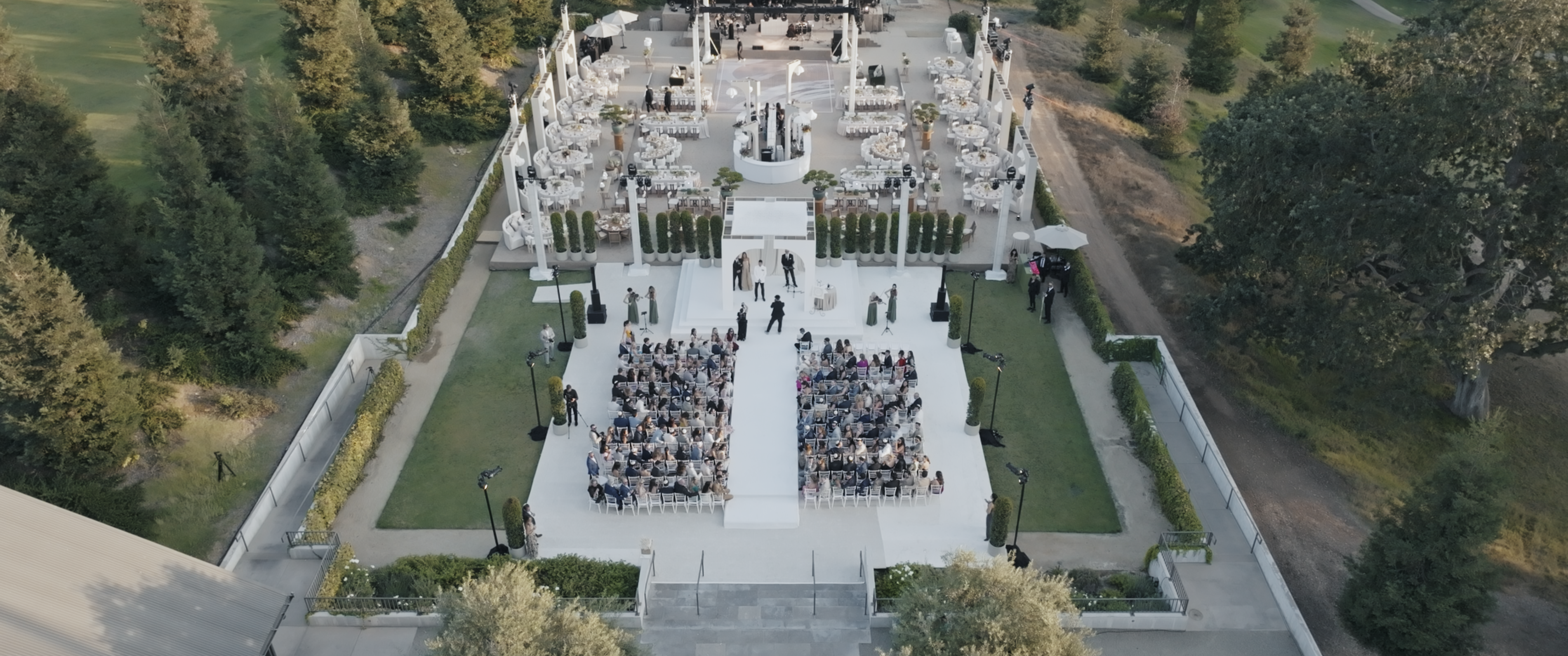 Ojai Valley Inn wedding ceremony aerial view with guests and floral design